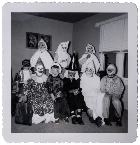 untitled image, old black and white photo of kids dressed up as witches, ghosts, and clowns.