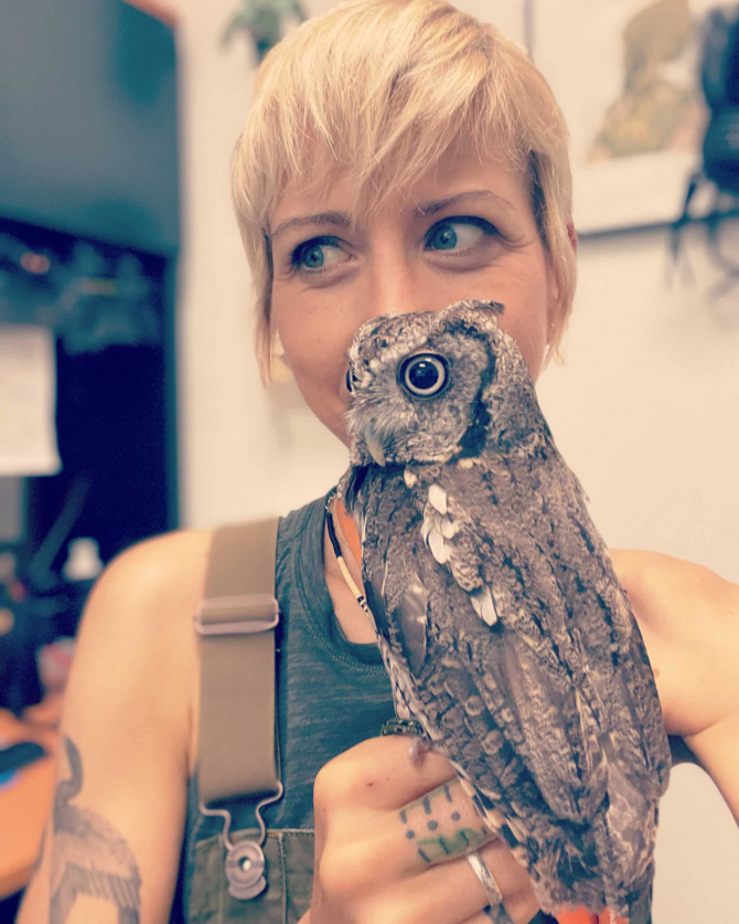 Autumn Kioti Horne pictured with an owl resting on her hand.
